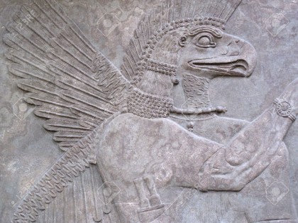 5032317-Assyrian-relief-865-860-BC-showing-an-eagle-headed-protective-spirit-Stock-Photo